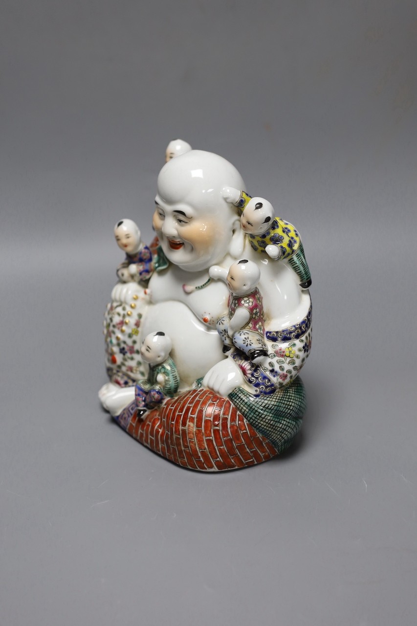 A Chinese Budai and boys group, 19 cms high.